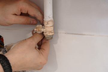 Plumbing Repair: Fixing a Leaking Pipe Fitting in a Kitchen