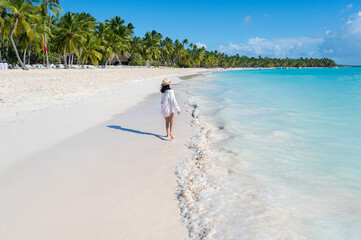 Woman walking on a beach in the Dominican Republic