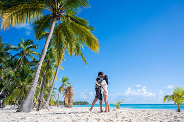 Couple kissing on a beach in the Dominican Republic, Saona Island