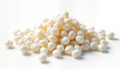 Pile of white sago pearls on white background. Close up view of raw food ingredient. Natural food product suitable for asian cuisine desserts. Starch granules. Ideal for cooking decorative use. High