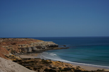 Scenic beach cliffs on South Australian coastal area. Maslin Beach, Pt Willunga area with waves. Artwork with artistic tones.