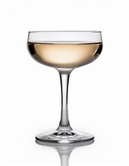 A coupe glass filled with a light golden liquid.