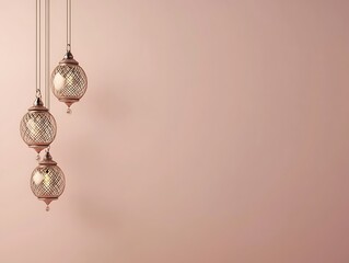 Three Elegant Rose Gold Hanging Lanterns Against A Pale Pink Wall