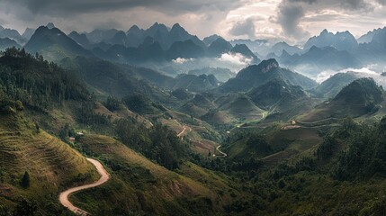 Fototapeta premium Majestic Mountain Panorama: A Serene Vista of Verdant Hills and Winding Roads