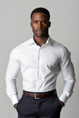 Obraz premium Confident Man in White Formal Shirt and Dark Trousers