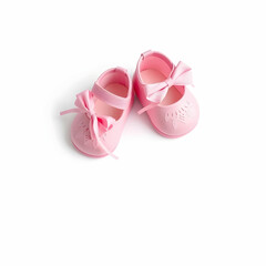 Pink baby girl shoes isolated on the blank background