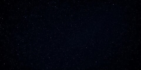 Fototapeta premium Night sky filled with sparkling stars against a black background, galaxy background, celestial, star background, Night sky with stars and galaxy in outer space, universe background