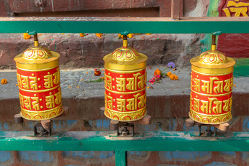 Prayer wheels is spinned by devotees to aid for meditation and accumulating wisdom, good karma and putting negative energy aside