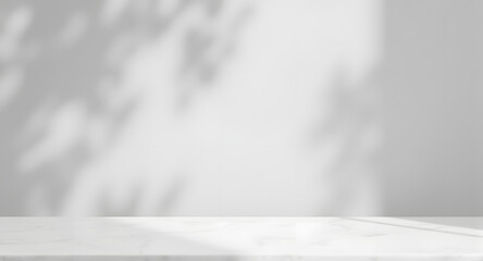 White Marble Tabletop with Soft Leaf Shadows on Wall Background