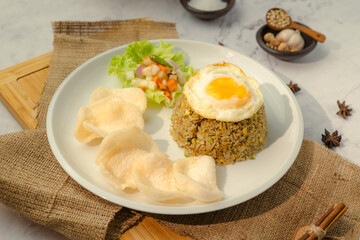 A plate of food with rice, egg, and vegetables