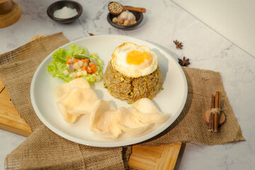A plate of food with rice, egg, and vegetables