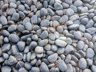 Sea pebbles on the beach, close-up. Pebble background for publication, poster, calendar, post, screensaver, wallpaper, postcard, banner, cover, website. High quality photography