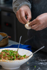 Hand making Chinese baozi

