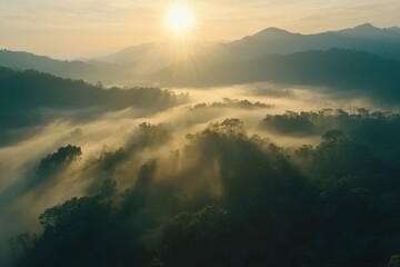 Obraz premium Misty Mountain Sunrise: An Aerial View of Serene Landscape