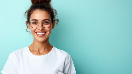 Fototapeta premium cheerful nurse with glasses smiles brightly against turquoise background