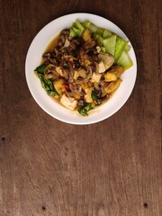 stir fry mushrooms with green mustard and egg as garnish 