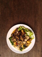 stir fry mushrooms with green mustard and egg as garnish 