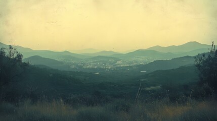Fototapeta premium Mountain Ranges & Town Below