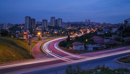 Obraz premium Night Cityscape: Highway Intersection with Light Trails