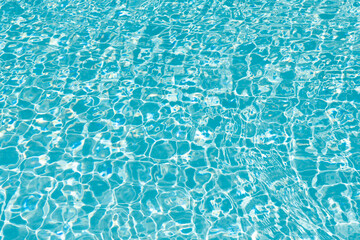 Summer vacation at ocean shore. Blue ocean rippled water texture reflection. Ripple water in summer pool. Sea surface background. Vacation resort water background. Sea beach. Caribbean sea