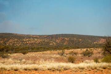 Scenic view of the Australian outback in the Northern Territory with hills and dry grass