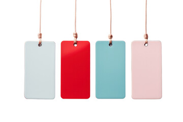 An overhead shot of a cluster of four tags in red, blue, pink, and green, placed randomly on a pristine white surface. Each tag features a clean and modern look