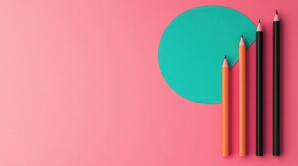 Obraz premium A vibrant composition featuring colored pencils and a teal circle against a pink background, emphasizing creativity and artistic expression.