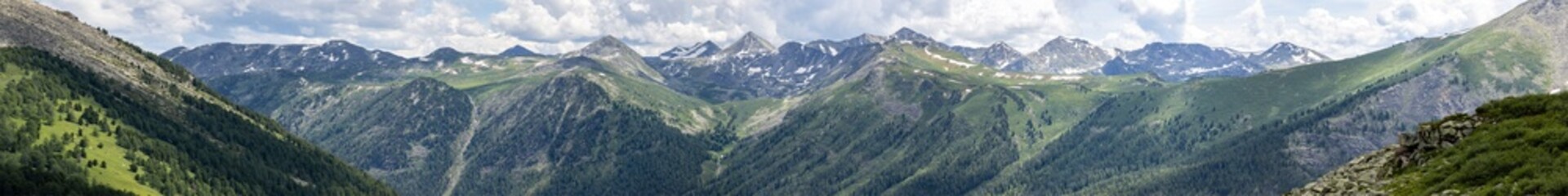 Fototapeta premium panorama of mountains and sky with clouds in summer 