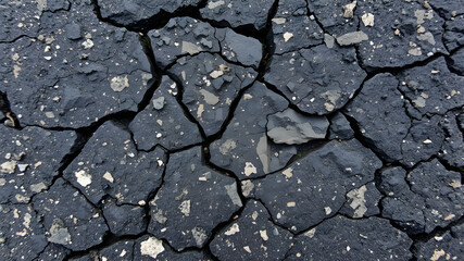 Fototapeta premium Black dark brown gray stone rock granite basalt texture background. Mountains surface. Close-up. Cracked broken crumbled. Generative AI