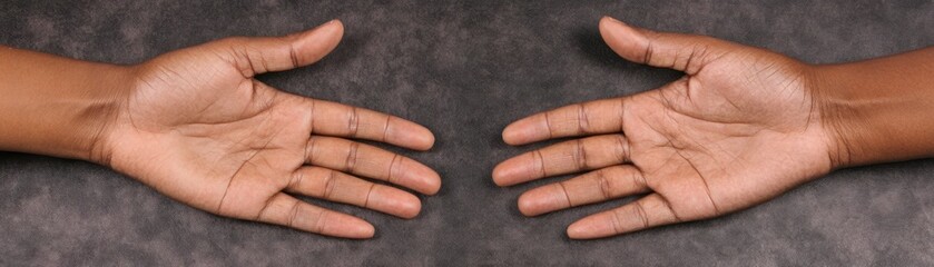 Fototapeta premium Two Open Hands Presented Towards Each Other on a Textured Background, Symbolizing Connection, Collaboration, Support, and Human Interaction with Warm Tones and Textures