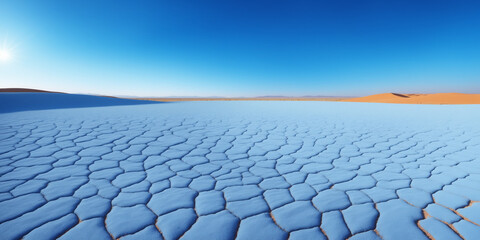 Vast Desert Scene Showing Dunes and Cracked Dry Earth Under Blue Skies