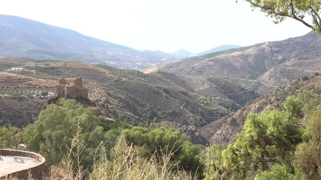 Andalusian old castle at the foothills of Sierra Nevada mountain range in Lanjaron village, Alpujarra, Andalucia, Spain. High quality 4k footage