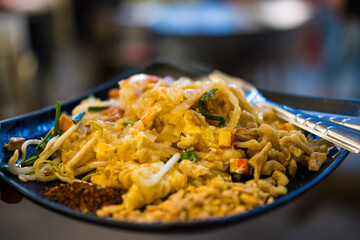 Close up Pad Thai noodle with tofu, egg and peanut and mixed vegetable. Healthy menu
