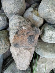 Ecological stone pile, a natural paradise in the garden, small caves and niches offer hiding places, protection and habitat for many animals, copy space, selected focus, narrow depth of field