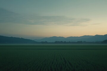 Naklejka premium Tranquil Morning View of Mountains and Fields