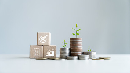 Stack of growth coins Annual financial plan for saving money, budgeting, taxes, investing, finances, savings, and New Year's retirement ideas.