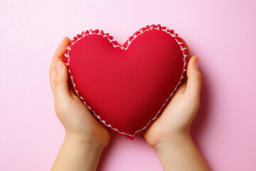 Fototapeta premium Hands holding a red heart isolated