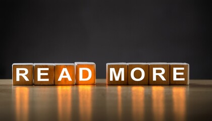 Obraz premium もっと読むを意味する英語のフレーズREAD MOREの文字が書かれたカラフルなキューブブロック。 aiで生成 