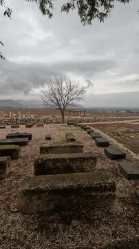 Ruins of ancient structures at Tel Hazor, northern Israel, captured on a cloudy winter day, offering a glimpse into the region's rich archaeological heritage.