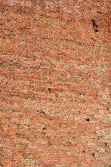 Detail of an old orange brick wall