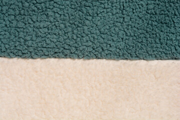 Fototapeta premium A close-up of the texture of green and white fleece fabric