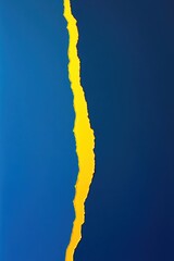 An abstract image showcasing a bold tear of vibrant yellow against a serene blue background, perfect for thematic compositions.