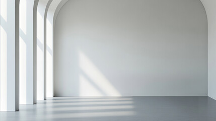 Obraz premium Minimalistic empty room with arched sunlight shadows on white wall, serene interior space.