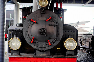 Close-Up View of a Vintage Steam Locomotive Train Engine Front