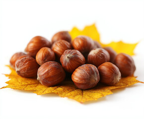 Fresh Hazelnuts with Bright Yellow Maple Leaf on White Background &ndash; Perfect Autumn-Themed Food and Nature Concept Image for Seasonal Designs and Promotions