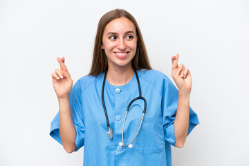 Young nurse woman over isolated on white background with fingers crossing