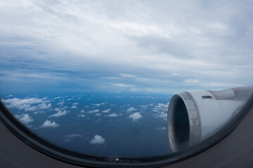 Beautiful sky seen from the plane window. Earth and sky as seen through window of an airplane.