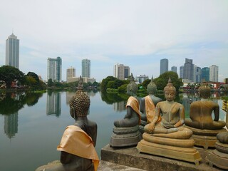 buddha statue at wat pho city background.