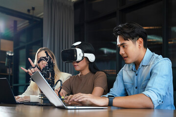 Group team work programer and engineer working AI robot arm system.  Business people Start-up production process technology and logic control constructing arm system project