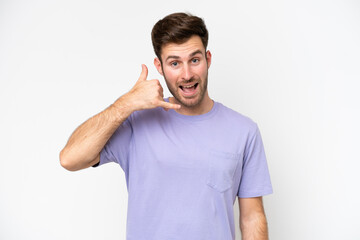 Obraz premium Young caucasian man isolated on white background making phone gesture. Call me back sign
